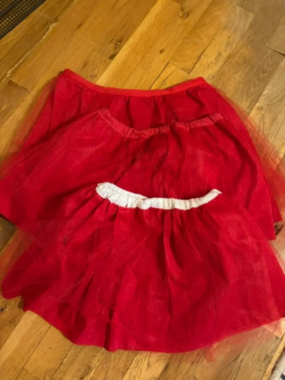 Eight Red Country Recital Skirts with Sashes